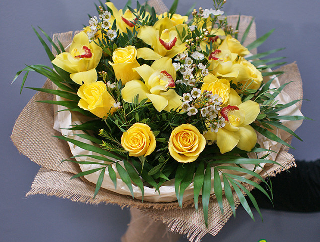 Bouquet with yellow roses and orchids photo